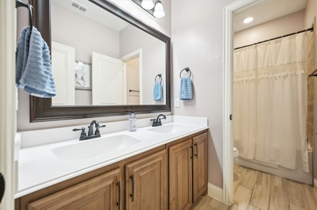 Full bath with a sink, visible vents, toilet, and double vanity | Image 20