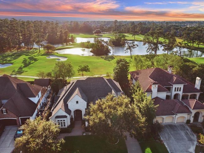 Charming home with stunning golf course views, set amidst lush greenery and serene water features. The neighborhood offers a picturesque and tranquil environment, perfect for relaxation and recreation. | Image 5