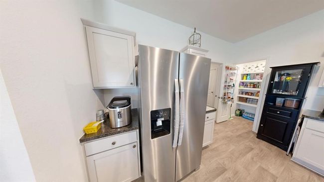 Coffee station next to the stainless-steel refrigerator | Image 17