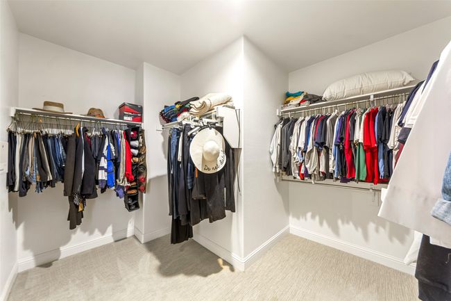 Spacious master closet adjacent to the master bathroom and fully carpeted. | Image 26