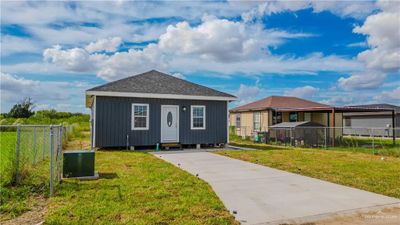 View of front facade with a front lawn | Image 2