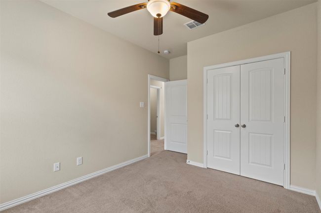 Unfurnished bedroom featuring carpet, a closet, and ceiling fan | Image 20