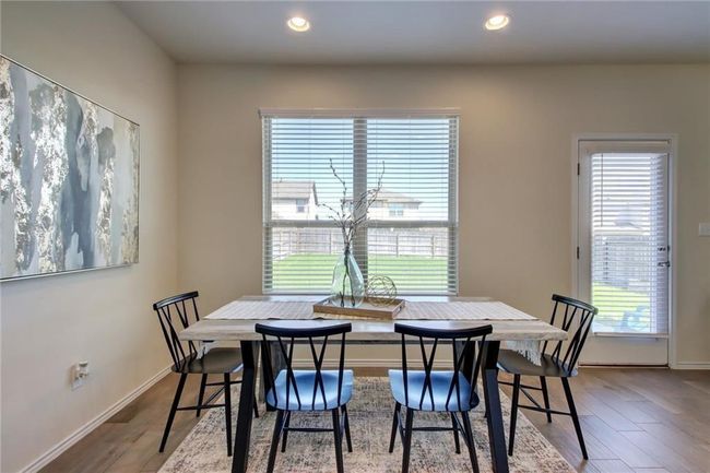 Dining area with plenty of natural light, wood finished floors, and recessed lighting | Image 14
