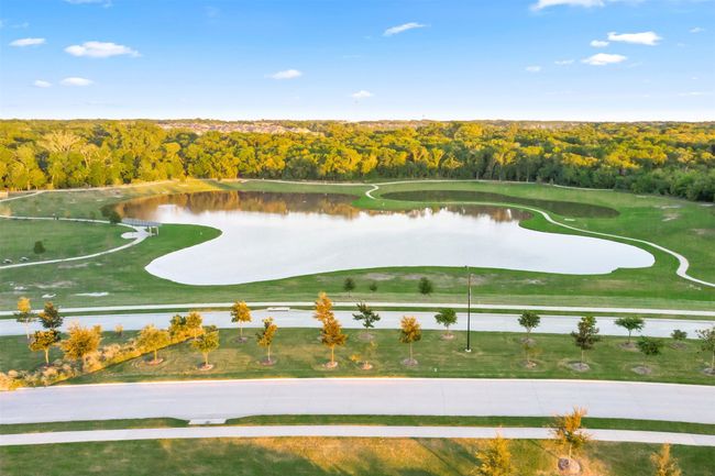 View of property location with a large body of water and a forest | Image 36