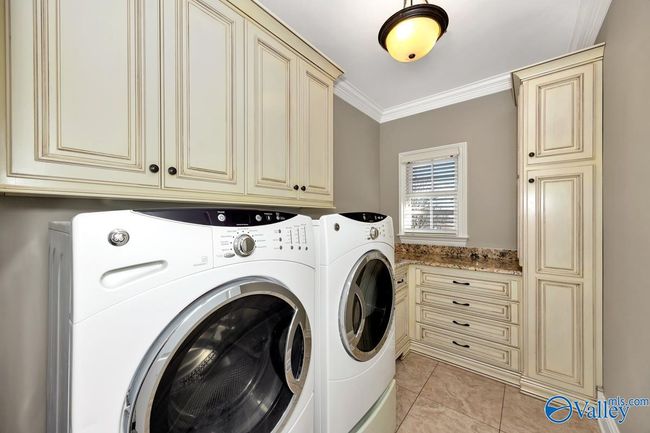 Tile flooring, wood cabinetry | Image 20