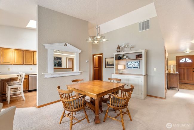 Plenty of room to entertain in this spacious dining area, open to the kitchen and living room | Image 9