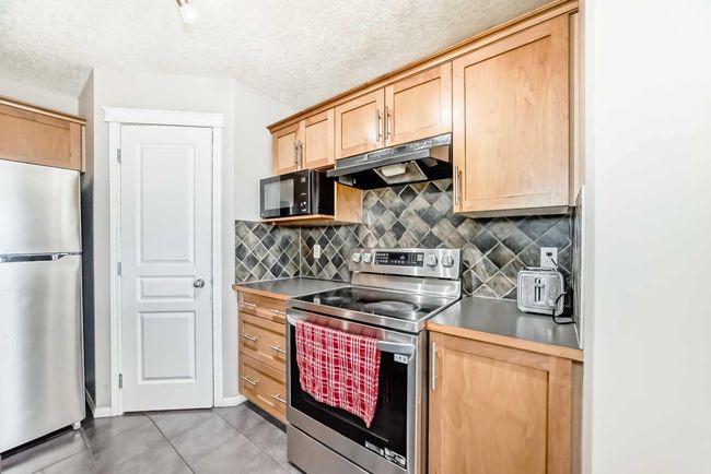 66 Evansbrooke Terr Nw, House other with 5 bedrooms, 4 bathrooms and 4 parking in Calgary AB | Image 4