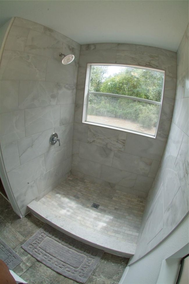 Walkin Master Bath Shower with Custom Ceramic Tile and Marble Brick Floor | Image 33