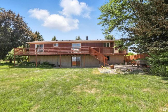 Back of property featuring a deck and stairway | Image 32