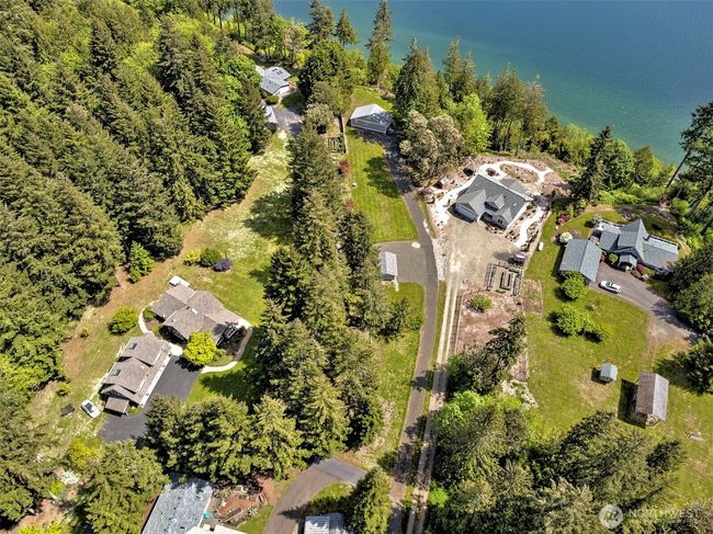 Aerial shows surrounding neghborhood of nice homes. | Image 26