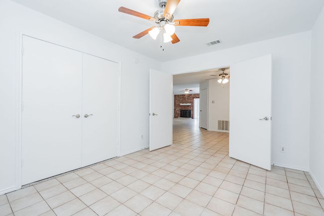 Unfurnished bedroom featuring a closet, ceiling fan, baseboards, and visible vents | Image 22