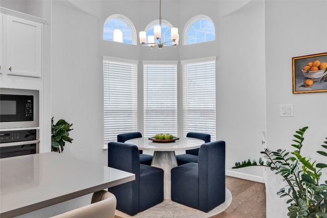 Breakfast area with a chandelier and hardwood / wood-style floors | Image 8