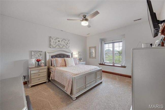 Bedroom featuring light carpet and a ceiling fan | Image 31