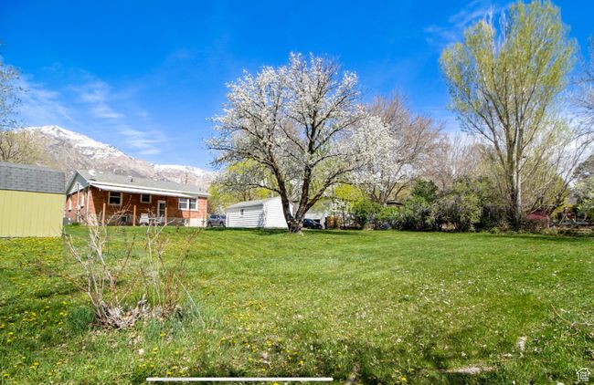 View of green lawn featuring a mountain view | Image 23