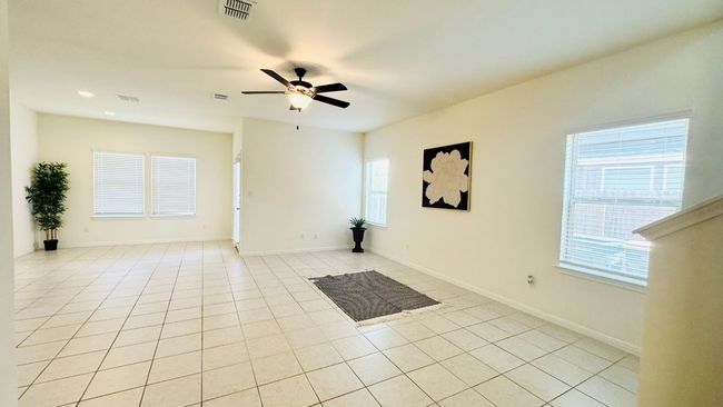 Unfurnished room featuring light tile patterned floors, ceiling fan, and recessed lighting | Image 10