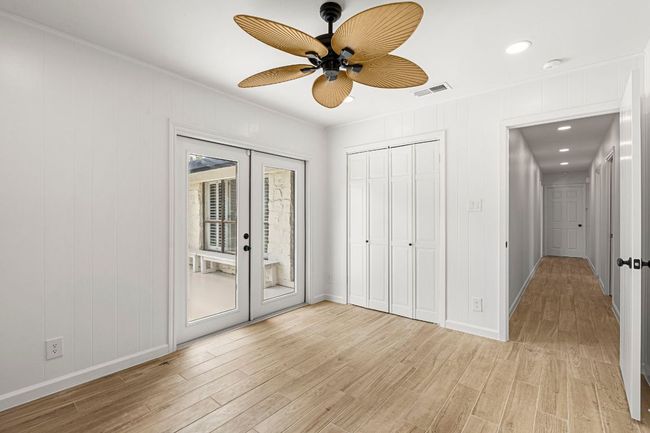 Unfurnished bedroom featuring french doors, access to outside, light wood-style flooring, recessed lighting, and a ceiling fan | Image 28