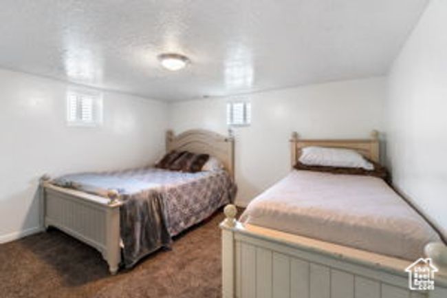 Bedroom with carpet flooring and multiple windows | Image 19