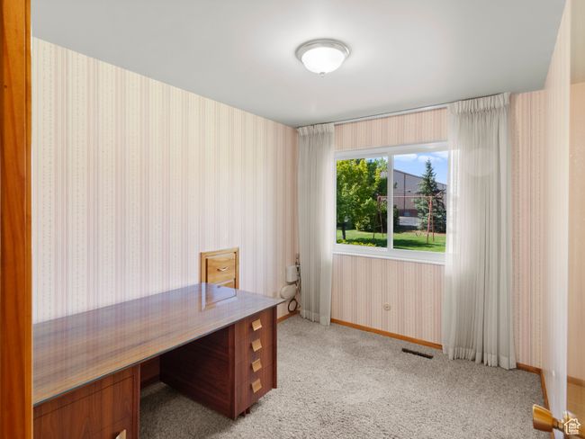 Home office featuring wallpapered walls, light colored carpet, and baseboards | Image 17