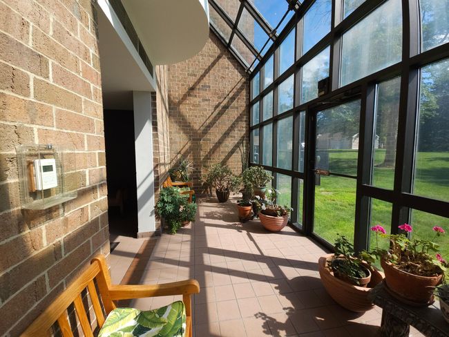 Solarium on main level off the lobby entrance. | Image 7