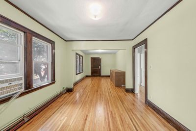 Upper unit dining room looking into living room.jpg | Image 1