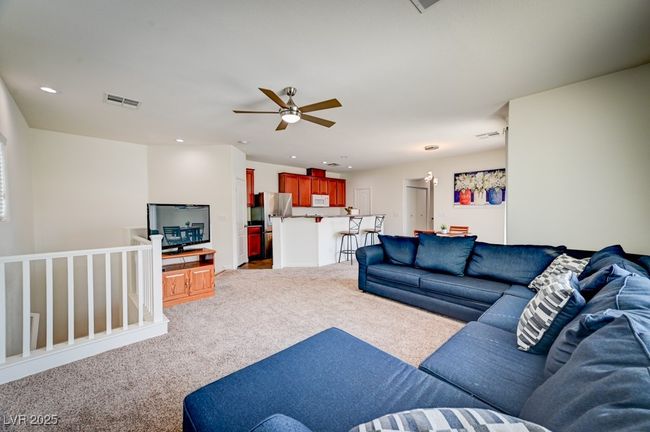 Living room with carpet, ceiling fan, and recessed lighting | Image 6