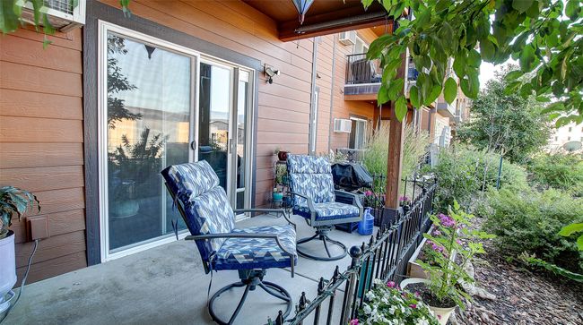 Back Patio offers privacy and comfort. Fenced in for a small dog, pull down shades for the late summer months. Beautiful sunsets. Secure storage closet located off patio. | Image 30