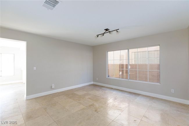 Empty room with baseboards and visible vents | Image 5