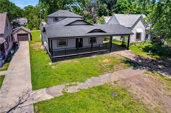 View of front of property with driveway, roof with shingles, a front lawn, a carport | Image 8