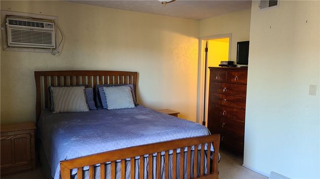 Upstairs Primary bedroom with full bath. Air-conditioner is not in working order. | Image 5