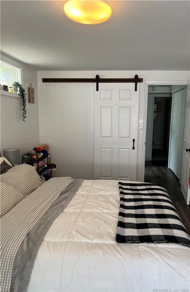 Lower Level Bedroom with Barndoor closet and separate entrance. | Image 25