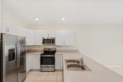 0 - 11103 W 32nd Ln, Townhouse with 3 bedrooms, 2 bathrooms and null parking in Hialeah FL | Image 2