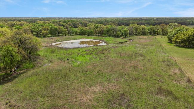 Aerial view featuring a water view and a view of trees | Image 12