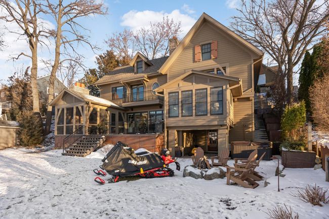 Winter view - great fire pit area too. Note the steps on the right side of the house for easy access. The left side of the house has a ramp for driving vehicles on | Image 38