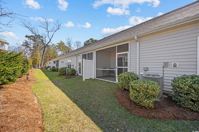 View of yard featuring a sunroom and central AC unit | Image 29