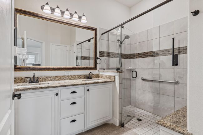 Primary Bathroom with large walk-in shower and granite countertops | Image 18