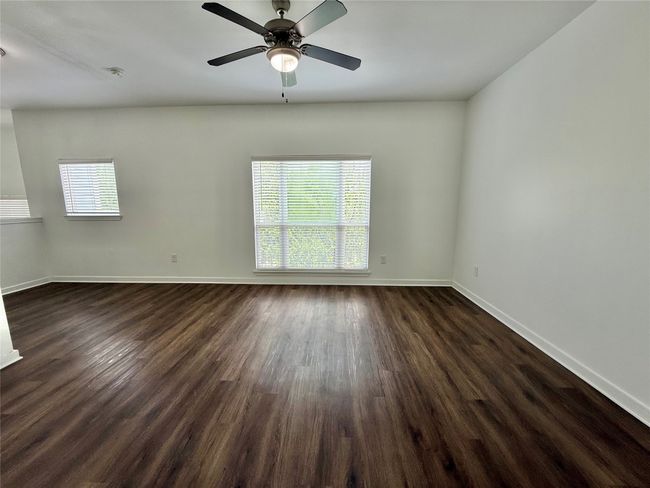 Spare room with plenty of natural light, dark wood finished floors, and baseboards | Image 17