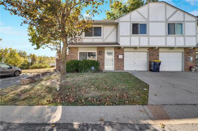 View of front facade featuring a garage | Image 1