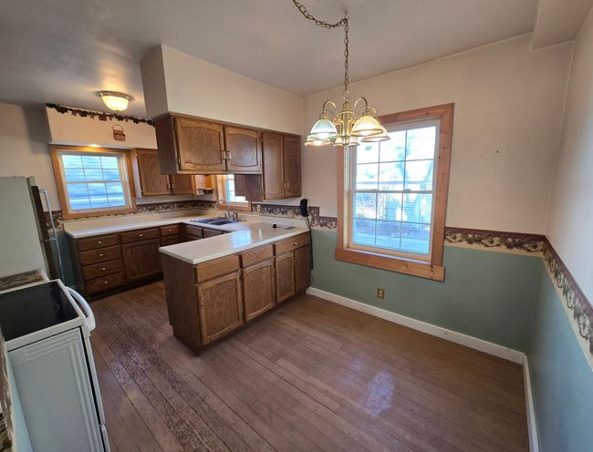 Dining area with chandelier-hardwood flooring | Image 8