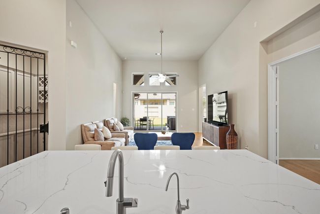 This home is perfect for entertaining! Just imagine yourself entertaining in this home. Notice the sliders...perfect for indoor/outdoor entertaining. | Image 10