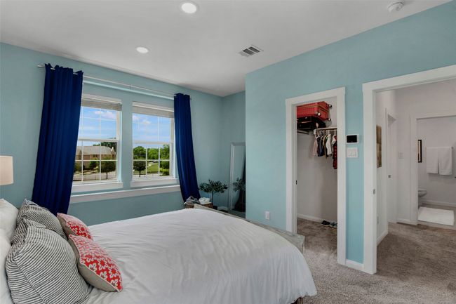 Bedroom featuring a spacious closet, baseboards, a closet, carpet, and recessed lighting | Image 22
