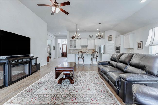 There’s ample space to accommodate a large sectional or a sofa and loveseat combination. A generous wall offers the perfect spot for a custom media unit or entertainment center. | Image 10