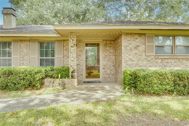 Storm door on the front of this home and it has a lovely glass door to the entrance of this home | Image 6