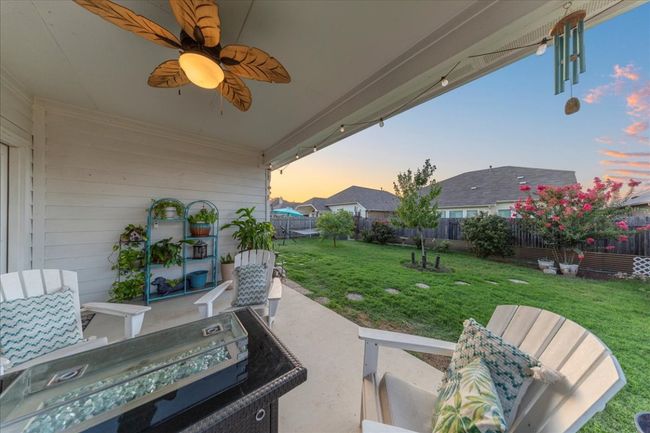 Fenced backyard with a patio and a ceiling​​‌​​​​‌​​‌‌​‌‌​​​‌‌​​‌‌​‌​​​​​‌ fan | Image 16