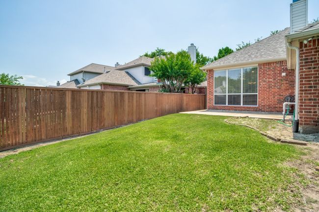View of back yard with a patio | Image 28
