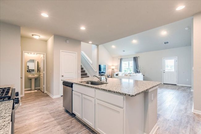 This view shows the half bath off the kitchen area | Image 10