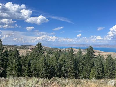 Property view of mountains featuring a water view | Image 1