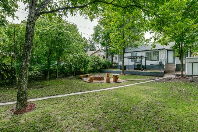 View of yard featuring a fire pit | Image 25