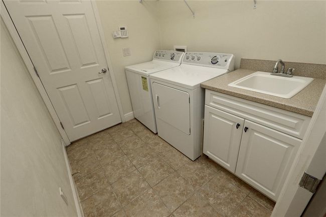 Laundry room with sink | Image 15