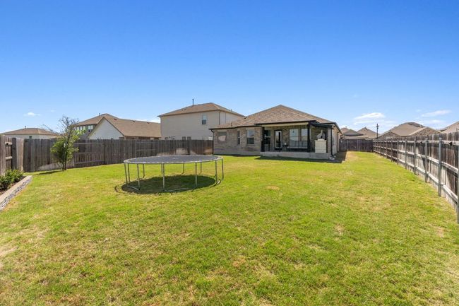 The yard offers expansive lawn space to fit your needs. | Image 33