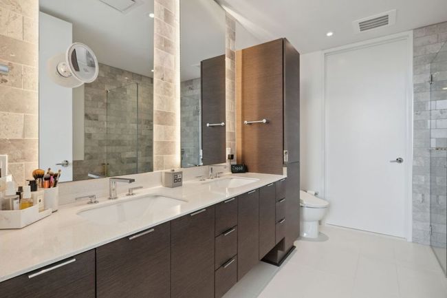 Full bath with double vanity, toilet, and a tile shower | Image 22
